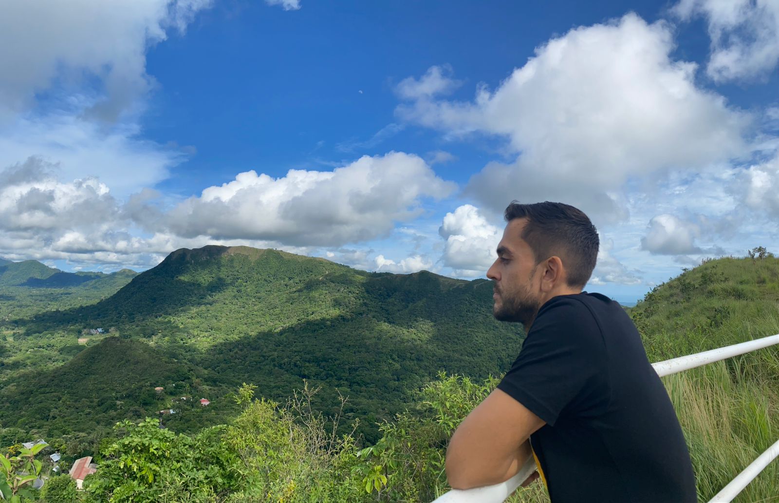 Sean Ali looking at a wide mountain view while thinking from a higher perspective