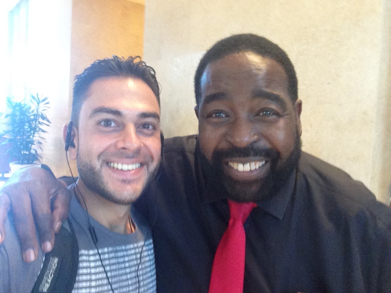 Sean Ali with Les Brown during a season of learning from higher-standard rooms