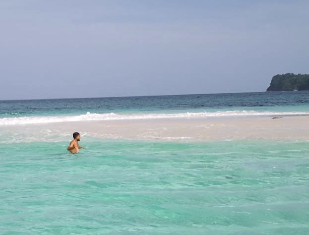 Blue tropical water from a Sean Ali travel and freedom season